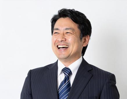 笑うビジネスマン 笑うビジネスマンの写真