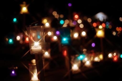玉ボケを背景に輝くキャンドルの灯り キャンドル,キャンドルナイト,ろうそくの写真素材