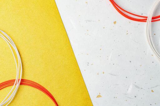 金箔入り和紙と水引の和風テクスチャー 和紙,水引,黄色の写真素材