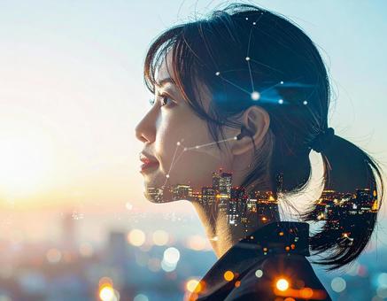 都市とネットワークイメージの女性の横顔 都市とネットワークイメージの女性の横顔の写真