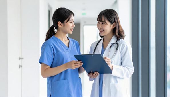医療イメージ 打合せする若い医療関係者 医療イメージ 打合せする若い医療関係者の写真