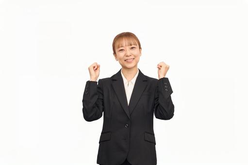 ビジネススーツを着た女性のガッツポーズ ビジネススーツを着た女性のガッツポーズ 女性,ビジネスウーマン,キャリアウーマンの写真素材