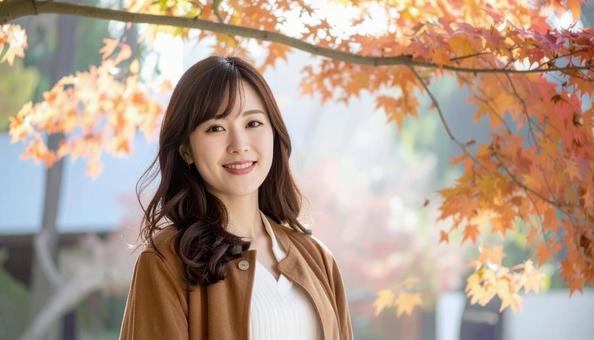 秋の背景に立つ日本人女性 秋の背景に立つ日本人女性の写真