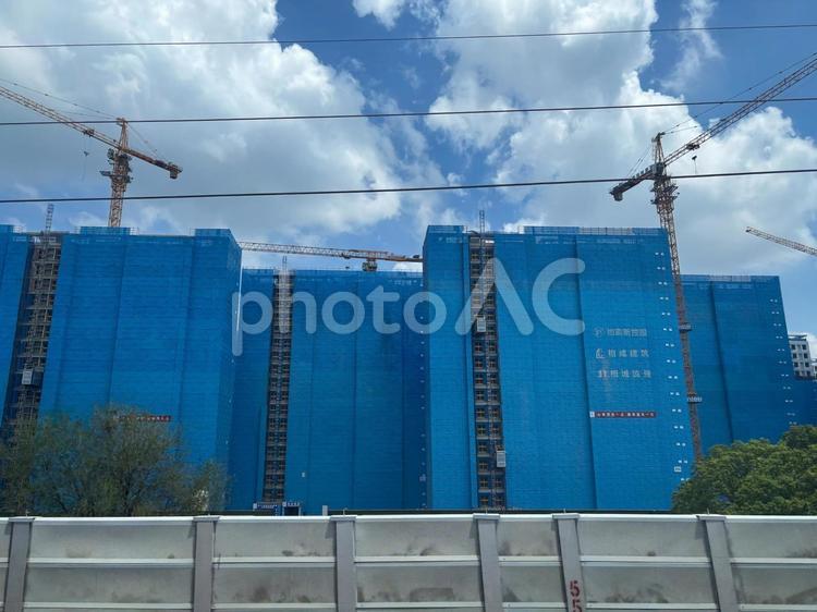 中国の高層建築現場と青い防護ネット 建設現場,高層ビル,中国の写真素材