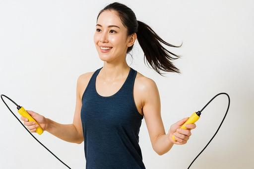 縄跳び運動をする女性・スポーツウェア姿の写真