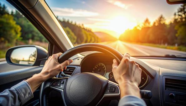 自動車を運転する男性の手 自動車を運転する男性の手の写真