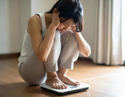 絶望する女性の写真