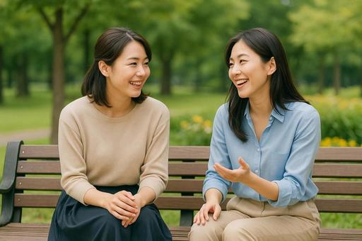 公園のベンチで語り合う友人 公園のベンチで語り合う友人の写真