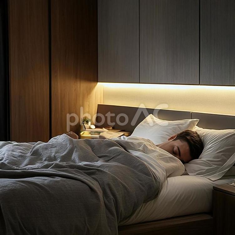 モダンな寝室で眠る若い男性の夜 男性,若い,寝ているの写真素材