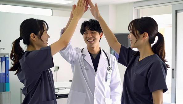 喜びを分かち合う看護師・医者 喜びを分かち合う看護師・医者の写真
