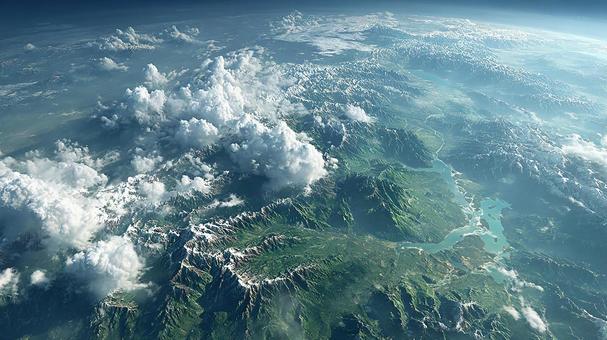 広大な山脈と雲が広がる地球のパノラマの写真