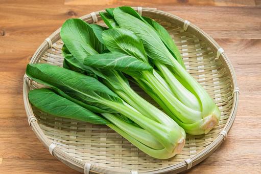 Bok choy arranged on a bamboo basket, JPG
