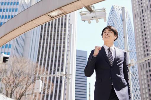 Japanese male businessman walking dashingly in the office district, new employee, male, businessman, JPG