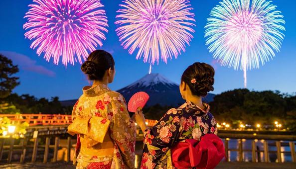 打ち上げ花火を見上げる浴衣姿の女性 打ち上げ花火を見上げる浴衣姿の女性の写真