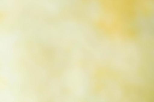 黄色の淡いぼかし背景の写真
