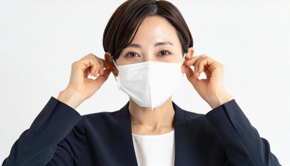 マスクをつける人 マスクをつける人の写真