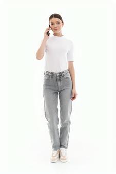 Woman making a phone call while looking at the camera, JPG Woman making a phone call while looking at the camera, JPG