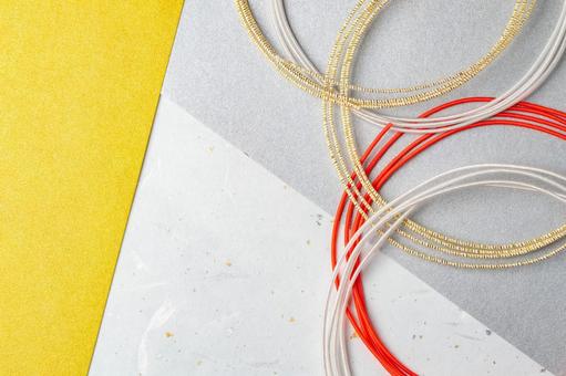 金銀と赤の水引が重なる和風背景素材 水引,背景,素材の写真素材