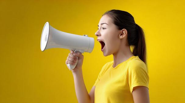A woman shouting a powerful message into a megaphone, female, young, megaphone, JPG