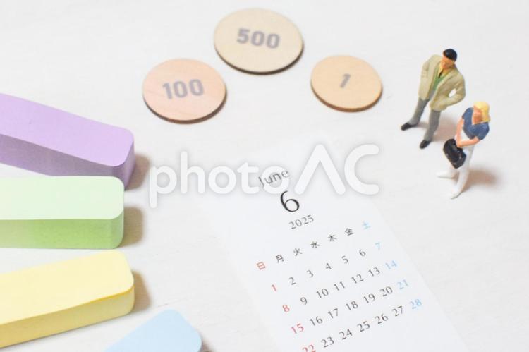 2025年6月のカレンダーとビジネスマン 6月,六月,カレンダーの写真素材