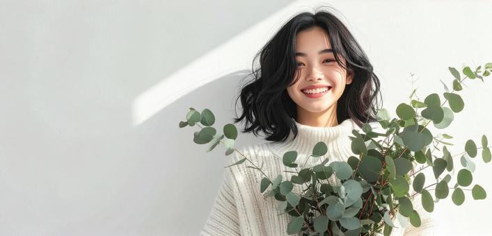 ユーカリの枝と女性 ユーカリの枝と女性の写真