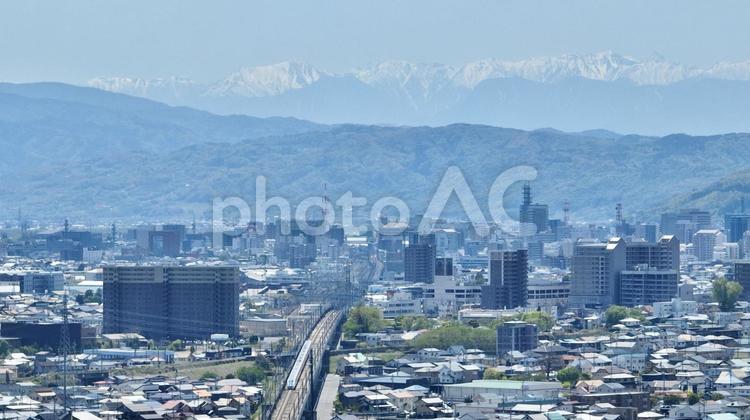 長野市街地と北アルプス 長野市,長野県,市街地の写真素材