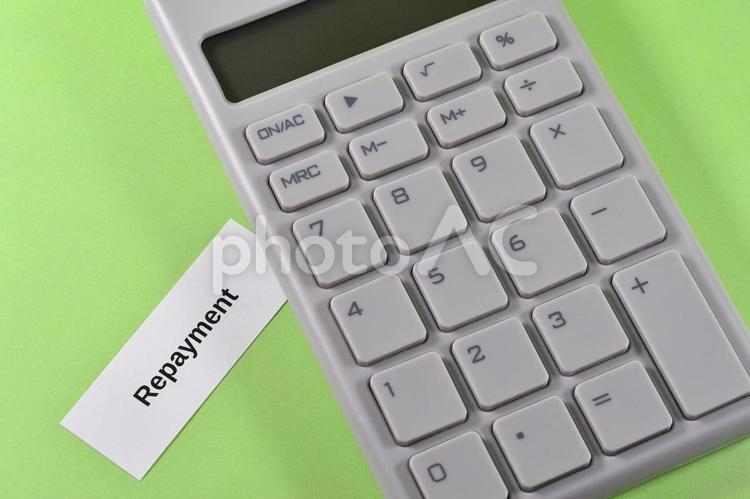 電卓とrepaymentで返済のイメージ repayment,返済,ローンの写真素材