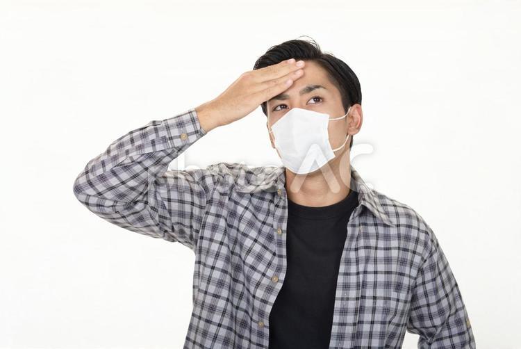 体調不良の男性 男性,ストレス,マスクの写真素材