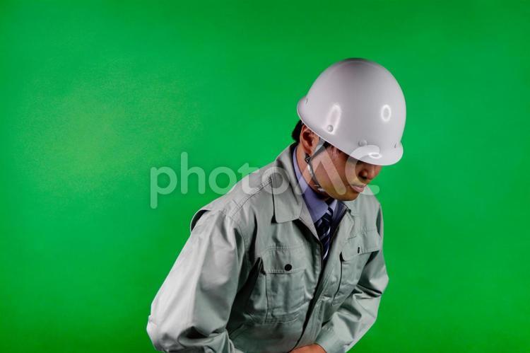 作業員の謝罪の姿 作業員,謝罪,作業服の写真素材