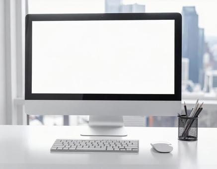 書斎のパソコンの白い画面の写真素材の写真