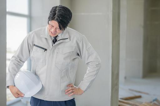 落ち込む作業員 落ち込む作業員 男性,作業員,建設作業員の写真素材