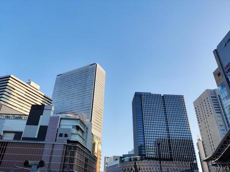 青空にそびえる大都市のビル群 ビル,ビル群,建物の写真素材