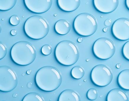 淡い水色のジェルと水滴 淡い水色のジェルと水滴の写真