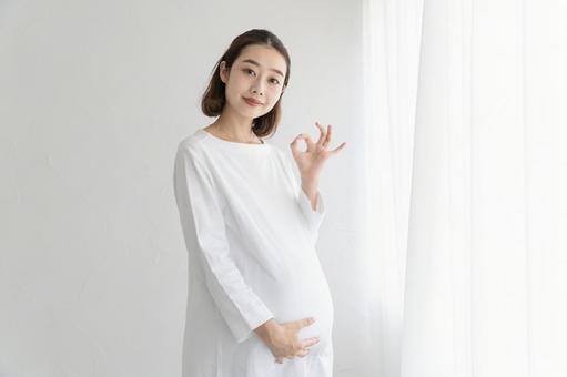 Pregnant woman giving an "OK sign", female, pregnant woman, pregnancy, JPG