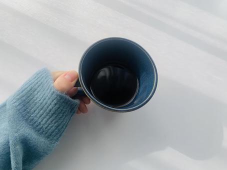コーヒーと手の写真