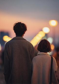 ぼかしの光と男女の後姿 ぼかしの光と男女の後姿の写真