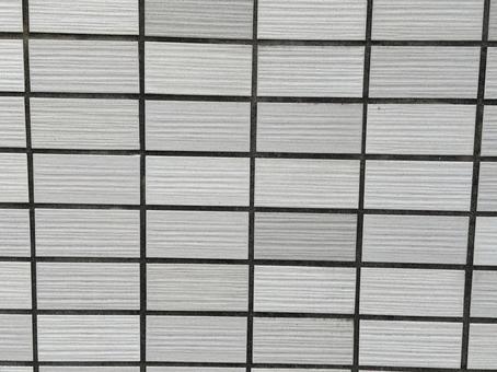 グレーのタイル壁　シンプルなテクスチャ タイル,外壁,壁の写真素材