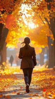 紅葉の中のスーツ姿の女性社員の後ろ姿 紅葉の中のスーツ姿の女性社員の後ろ姿の写真