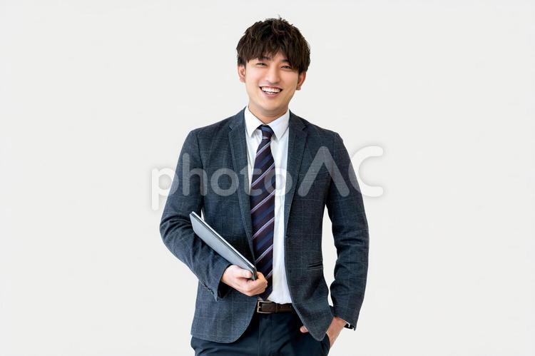タブレットを持つ笑顔のビジネスマン 男性,笑顔,ビジネスの写真素材