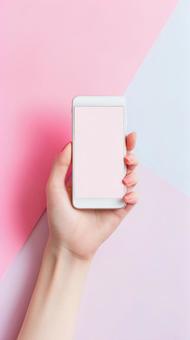 カラフルな背景にスマホを持つ女性の手2 カラフルな背景にスマホを持つ女性の手2の写真