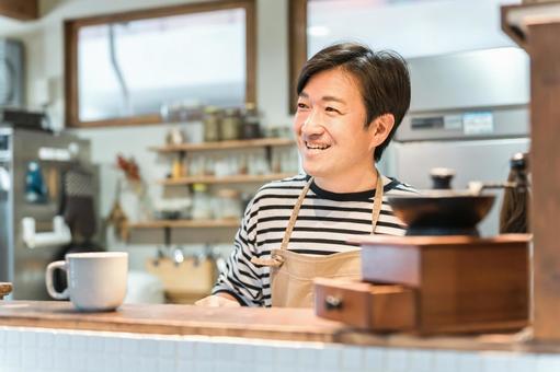 カフェ・喫茶店で働くミドル世代の男性 カフェ・喫茶店で働くミドル世代の男性 喫茶店,カフェ,オーナーの写真素材