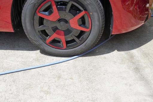 洗車時にタイヤにひっかかるホース06 洗車,自動車,コンパクトカーの写真素材