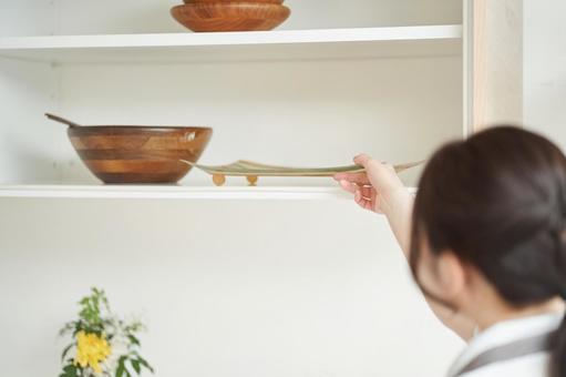Asian woman organizing the kitchen, JPG Asian woman organizing the kitchen, housekeeping acting, kitchen, storage, JPG