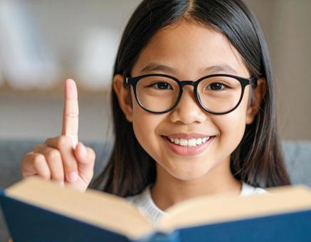 Smiling girl reading a book and solving doubts, question resolution, good at explaining, girl, JPG