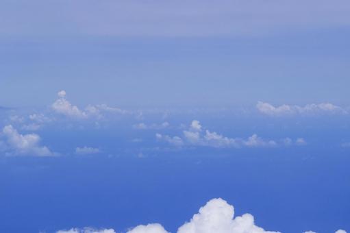 Beautiful clouds and ocean captured from the air, helicopter shot, blue sky, sea, JPG