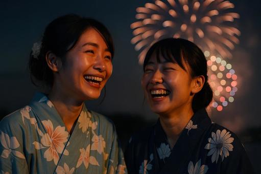 花火を見て笑い合う姉妹 花火を見て笑い合う姉妹の写真