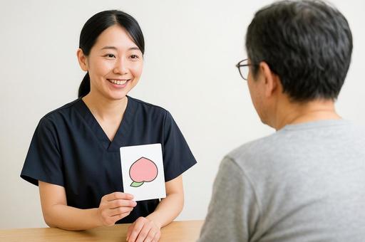 言語訓練のリハビリを行う言語聴覚士と患者 言語訓練のリハビリを行う言語聴覚士と患者の写真
