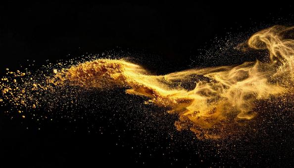 黒背景に舞う金粉のラグジュアリーデザインの写真