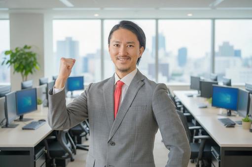 ガッツポーズする爽やかなビジネスマン ガッツポーズする爽やかなビジネスマン 男性,ビジネスマン,スーツの写真素材