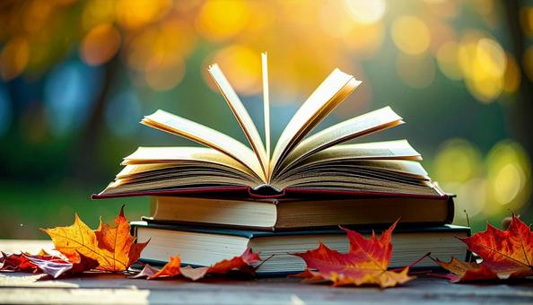 読書の秋 机の上の本 落ち葉の紅葉 読書の秋 机の上の本 落ち葉の紅葉の写真